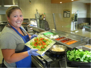 Sauté cook Jennifer Bettencourt shows healthier menu items available at Fairview Lakes.